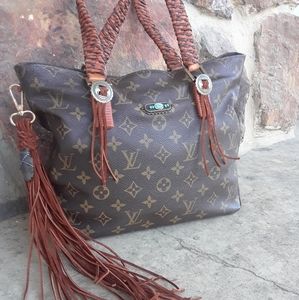 Fringed Louis Vuitton handbag